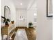 Bright foyer with hardwood floors, a stylish console table, and a view into the adjacent living spaces at 1180 Trident Maple, Lawrenceville, GA 30045