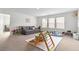Inviting playroom with a sofa, climbing structure, and ample space for children to play and explore at 1180 Trident Maple, Lawrenceville, GA 30045