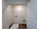 A dedicated laundry room with a wire shelf and tile flooring at 1964 Asher Ln # 47, Conyers, GA 30013