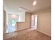 Upstairs hallway features carpet, a window and access to multiple rooms at 1964 Asher Ln # 47, Conyers, GA 30013