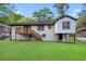 A spacious backyard features a deck, stairs, and lush green lawn perfect for outdoor activities at 2805 Long Way, Decatur, GA 30032