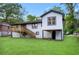 Expansive backyard features a deck and stairs that provide ample space for Gathering and recreational use at 2805 Long Way, Decatur, GA 30032