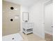 Modern bathroom featuring walk-in shower, vanity with white cabinets, and a sleek mirror at 2805 Long Way, Decatur, GA 30032