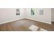 Well-lit bedroom featuring new hardwood flooring, fresh paint, and updated trim at 2805 Long Way, Decatur, GA 30032