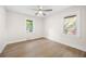 Bright bedroom with light wood floors, and natural light from two windows at 2805 Long Way, Decatur, GA 30032