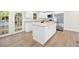 Bright kitchen features white cabinets, granite countertops, stainless steel appliances, and an island at 2805 Long Way, Decatur, GA 30032