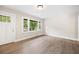 Bright living room featuring large windows, hardwood flooring, and a newly painted interior at 2805 Long Way, Decatur, GA 30032