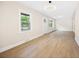 Bright living room features light wood flooring, many windows, and modern lighting at 2805 Long Way, Decatur, GA 30032