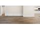 Open-concept living space featuring modern hardwood flooring and a view of the kitchen at 2805 Long Way, Decatur, GA 30032