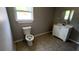This bathroom features a vanity with new faucet and updated flooring at 50 Ivy St, Porterdale, GA 30014