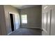 This cozy bedroom has closet space and lots of natural light at 50 Ivy St, Porterdale, GA 30014