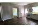 Bright and spacious kitchen with white cabinetry, hardwood floors, and modern appliances at 50 Ivy St, Porterdale, GA 30014