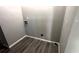 This laundry room has hook ups and easy to clean flooring at 50 Ivy St, Porterdale, GA 30014