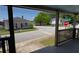 Street view from covered front porch of residential neighborhood at 50 Ivy St, Porterdale, GA 30014