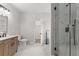 Bright bathroom featuring a glass shower, soaking tub, and white marble tile at 5863 Landers Loop, Fairburn, GA 30213
