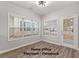 Bright flexspace boasts multiple windows and a door leading to a covered front porch at 5863 Landers Loop, Fairburn, GA 30213