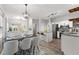 Open concept kitchen with granite countertops and stainless steel appliances at 5863 Landers Loop, Fairburn, GA 30213