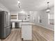 Spacious kitchen with stainless steel appliances, and an island with seating at 5863 Landers Loop, Fairburn, GA 30213
