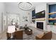 Cozy living room with stylish furniture, fireplace, and contemporary design at 5863 Landers Loop, Fairburn, GA 30213