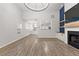 Bright open-concept living room featuring fireplace and abundant natural light at 5863 Landers Loop, Fairburn, GA 30213