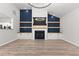 Spacious living room with modern fireplace and custom built-in shelving at 5863 Landers Loop, Fairburn, GA 30213