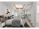 Serene main bedroom boasts trey ceilings, natural light, and ample space at 5863 Landers Loop, Fairburn, GA 30213