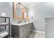 Bathroom showcasing a double vanity with stylish lighting and modern fixtures at 103 Campground School Rd, Dallas, GA 30157