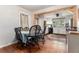 Cozy dining area with hardwood floors and a view into the modern kitchen at 103 Campground School Rd, Dallas, GA 30157