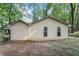 Home exterior with tan siding, showcasing a well-maintained facade and inviting backyard space at 103 Campground School Rd, Dallas, GA 30157