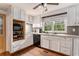Updated kitchen featuring white cabinets, modern appliances, and hardwood floors at 103 Campground School Rd, Dallas, GA 30157