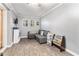 Cozy living room with gray sectional couch and natural light from the windows at 103 Campground School Rd, Dallas, GA 30157