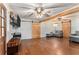Spacious living room featuring hardwood floors, a ceiling fan, and barn doors at 103 Campground School Rd, Dallas, GA 30157