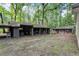 Expansive property featuring a shed, storage building, and natural surroundings, offering versatility at 103 Campground School Rd, Dallas, GA 30157