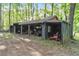 Large wooden storage building with ample space for equipment, tools, and outdoor essentials at 103 Campground School Rd, Dallas, GA 30157