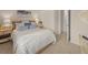 Bright bedroom with a comfortable bed, complete with stylish pillows and a side table at 115 Maplewood Ln, Conyers, GA 30094