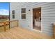 Outdoor deck area next to home, with an entrance to indoor dining at 115 Maplewood Ln, Conyers, GA 30094