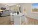 Bright dining area with white table and chairs, next to a spacious living room at 115 Maplewood Ln, Conyers, GA 30094