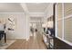 Inviting foyer with hardwood floors, elegant lighting, and an open view of the staircase at 115 Maplewood Ln, Conyers, GA 30094