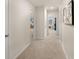Hallway with carpet and doors leading to various rooms in the house at 115 Maplewood Ln, Conyers, GA 30094