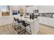 Open kitchen featuring a large island, granite countertops, and modern stainless steel appliances at 115 Maplewood Ln, Conyers, GA 30094