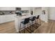Well-designed kitchen featuring a central island, sleek countertops, and modern appliances at 115 Maplewood Ln, Conyers, GA 30094