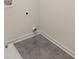 Laundry room features gray floors with white trim at 115 Maplewood Ln, Conyers, GA 30094