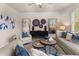 Comfortable living room with blue accents, modern furniture, and a cozy atmosphere at 115 Maplewood Ln, Conyers, GA 30094