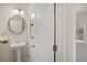 Stylish powder room with pedestal sink and modern fixtures at 115 Maplewood Ln, Conyers, GA 30094