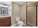 Bathroom features a modern vanity, toilet, and a glass-enclosed shower at 1215 Comet View Se Trl, Smyrna, GA 30082