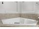 Close-up of a large bathtub with tiled surround at 1215 Comet View Se Trl, Smyrna, GA 30082
