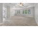 Expansive main bedroom features a tray ceiling, fan, large windows, and an en-suite bathroom at 1215 Comet View Se Trl, Smyrna, GA 30082