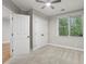 Bedroom features a carpeted floor, a window, and a closet at 1215 Comet View Se Trl, Smyrna, GA 30082