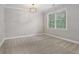 This bedroom has large windows, neutral paint, and modern light fixture at 1215 Comet View Se Trl, Smyrna, GA 30082
