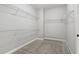 Walk-in closet with carpet flooring and wire shelving at 1215 Comet View Se Trl, Smyrna, GA 30082